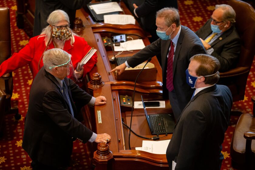 State Sen. Dale Righter, R-Mattoon, gestures as he talks with state Sen. Jim Oberweis, R-Sugar Grove, last May,