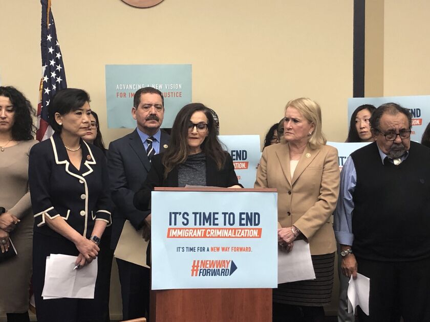 Alejandra Cano, center, speaks at a news conference in support of the “New Way Forward Act” introduced Tuesday by Rep. Jesus “Chuy” Garcia, D-Ill.