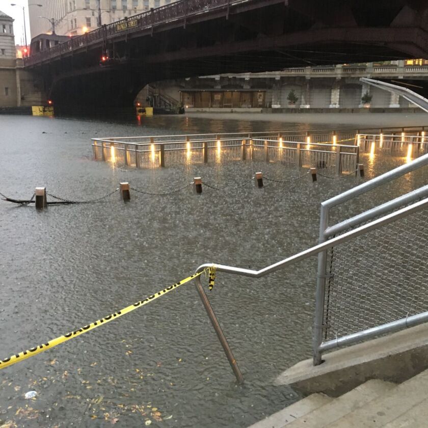 Heavy rains flooded the Chicago Riverwalk on Saturday. | John O’Neill/Sun-Times