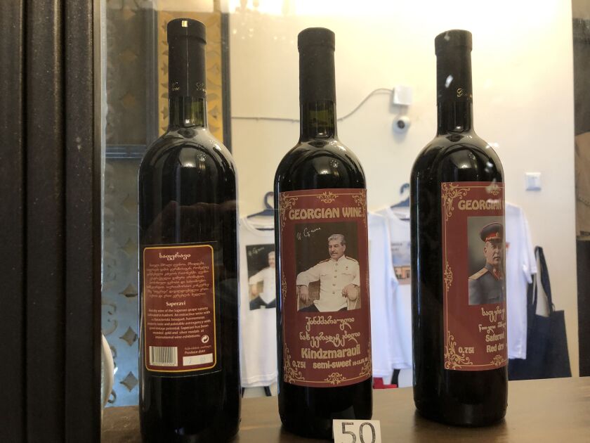 Wine bottles bearing the likeness of the dictator whosent a million or more of his countrymen to their deaths are sold in the gift shop at the Joseph Stalin State Museum.