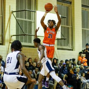 Young’s DJ Steward (21) shoots the ball against Lincoln Park.