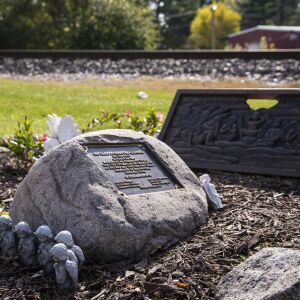 A memorial sits near train tracks at Algonquin Road and Northwest Highway in Fox River Grove, Wednesday afternoon, Oct. 21, 2020. On Oct. 25, 1995, inbound Metra train No. 624 crashed into a school bus at that intersection, killing seven teenagers and injuring the bus driver and 24 passengers.