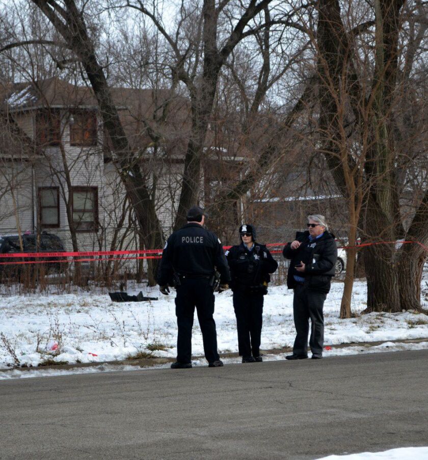 Police investigate a shooting Monday afternoon in the 13300 block of Calumet that critically wounded a 17-year-old boy. | Justin Jackson/Sun-Times