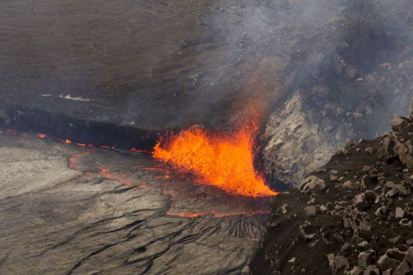 <small><strong>In this April 26, 2015 photo provided by U.S. Geological Survey Hawaiian Volcano Observatory, sparks rise from Kilauea volcano on Hawaii’s Big Island.</strong></small>