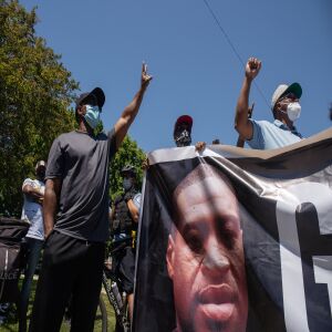 Protesters march down South Independence Boulevard in North Lawndale during the West Side interfaith peace march to demand police reform and equal opportunities for Black Americans on June 12, 2020. Protesters stopped at sites that Dr. Martin Luther King Jr. visited.