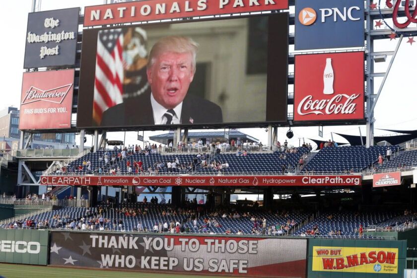 A message from President Donald Trump is shown on the video board before the Congressional baseball game, on Thursday, June 15, 2017, in Washington. | Alex Brandon/AP