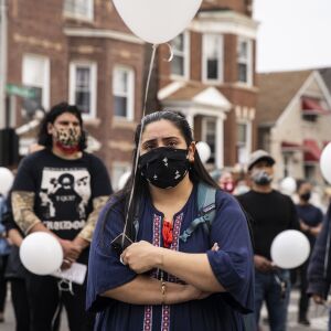 Rosie Cisneros, 26, of Gage Park, joins dozens for a vigil for 13-year-old Adam Toledo near the location of the shooting at West 24th Street and South Sawyer Avenue in Little Village, Monday afternoon, April 5, 2021. Toledo was fatally shot in the chest by a Chicago police officer in an alley west of the 2300 block of South Sawyer Avenue near Farragut Career Academy High School.