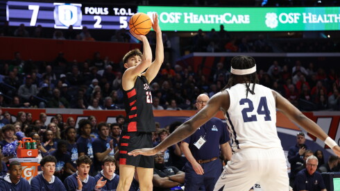 Benet's Ed Stasys (23) shoots a three against DePaul Prep at State Farm Center.