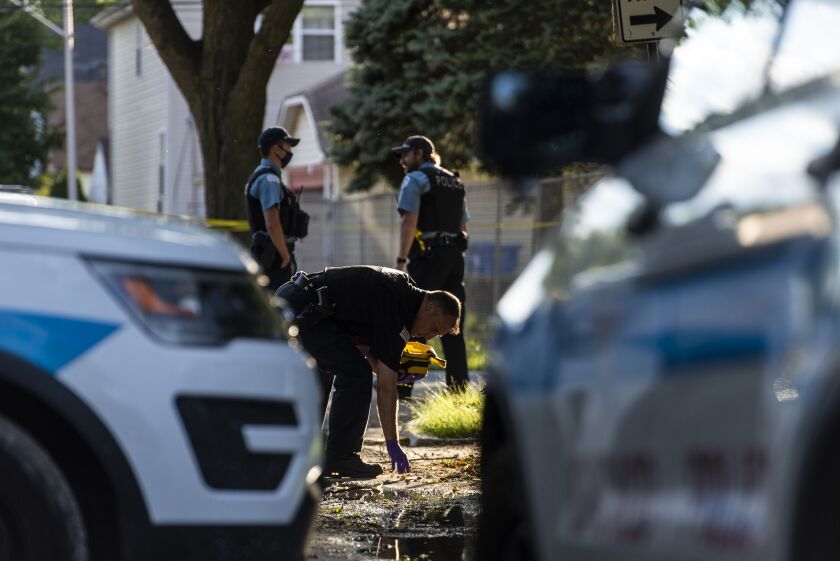 Chicago police investigate the scene where multiple people were shot in the 9200 block of South Ellis Ave. in the Burnside neighborhood, Tuesday, June 23, 2020. | Tyler LaRiviere/Sun-Times