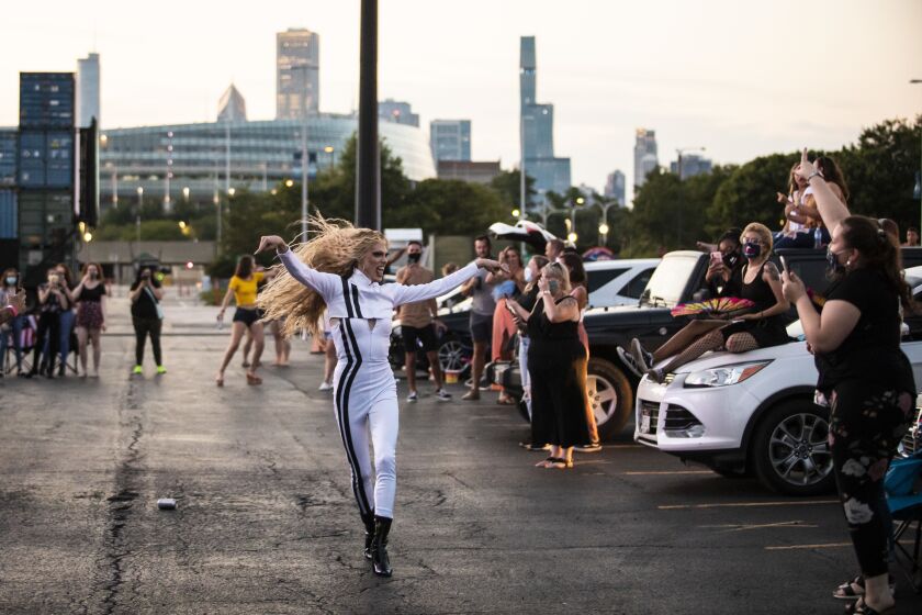 Gigi Goode runs through the socially-distant crowd during Drive ‘N Drag presented by Voss Events at Soldier Field, Friday night, Aug. 7, 2020.
