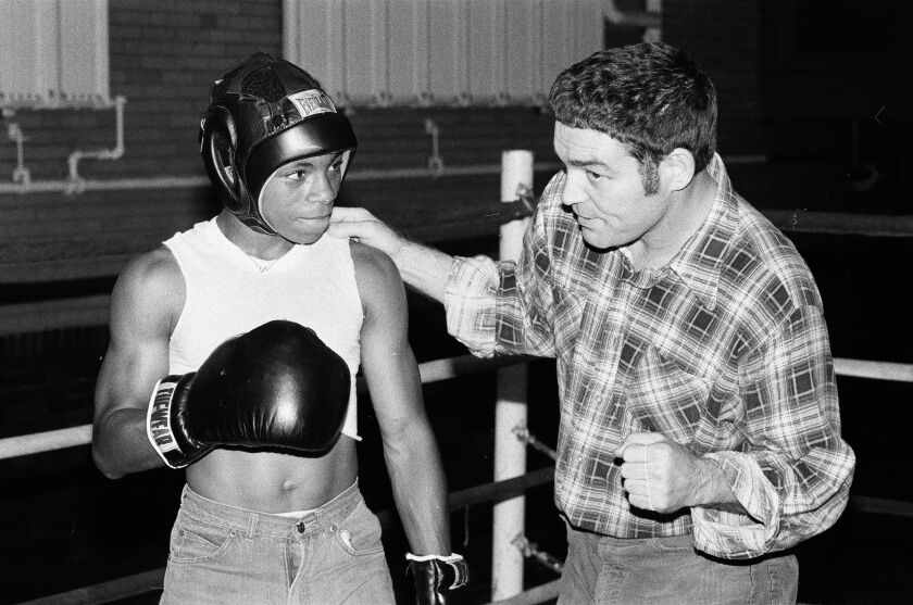 Tom O’Shea giving a boxing lesson at King High School.