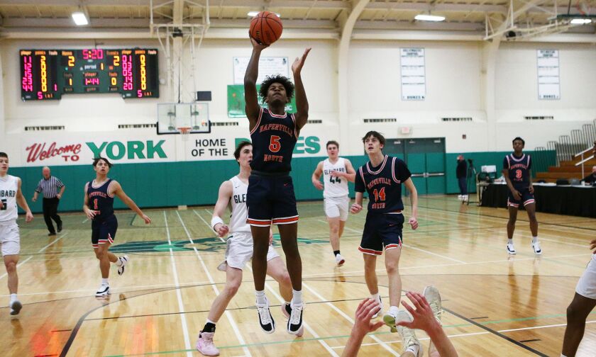 Naperille North’s Luke Williams (5) shoots from the lane.