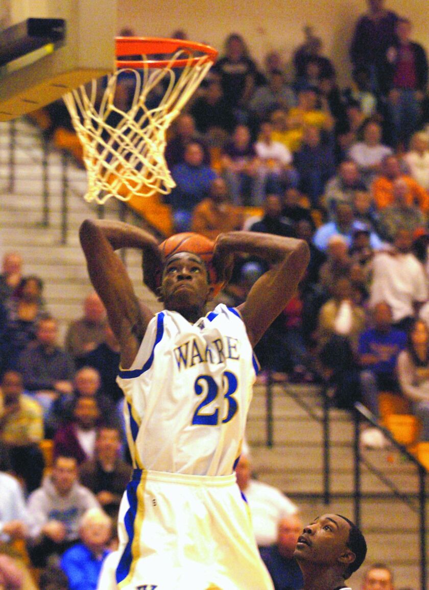 Warren’s Brandon Paul dunks against Zion-Benton.
