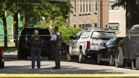 Federal Bureau of Investigation agents stand in the 3700 block of West Lexington Street in East Garfield Park, Friday, May 29, 2026, a day after Abdulhafedh H. Abdulhafedh, who was on parole for bank robbery, was killed in shooting involving the FBI.