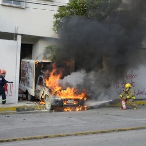 A truck burns at the entrance to the Palacio de Justicia in Iguala in state of Guerrero on September 27, 2022 during a demonstration by students of Ayotzinapa’s Normal Rural School to demand justice for the 43 students who disappeared in Iguala 2014.