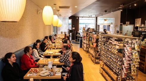 Inside Southport Grocery and Cafe, 3552 N. Southport Ave., patrons enjoy breakfast on Friday morning.