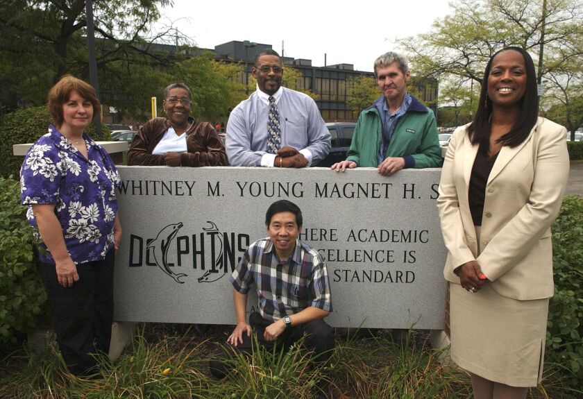 Principal Joyce Kenner (far right) poses in September 2005 with teachers who had worked at Whitney Young Magnet High School since it opened in 1975. (L to R): Bernadette McHale, Theadora McNeil, Denis Gully, Jay Lee (kneeling), Thomas Abecket and principal Dr. Joyce Kenner.