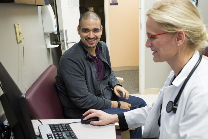 Jaime Diaz reviews his records with Dr. Rasa Kazlauskaite at Rush University Medical Center’s Triangle Office Building on Thursday, March 24, 2017. Diaz has lost 102 pounds since he enrolled in the ELM Program for pre-diabetes in the summer of 2013 and ha