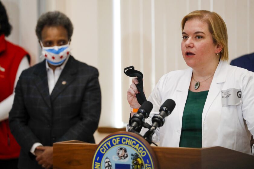 Chicago Public Health Commissioner Dr. Allison Arwady (speaking) and Mayor Lori Lightfoot appear at Loretto Hospital Dec. 15, when the city administered its first-ever COVID-19 vaccine doses to health care workers.