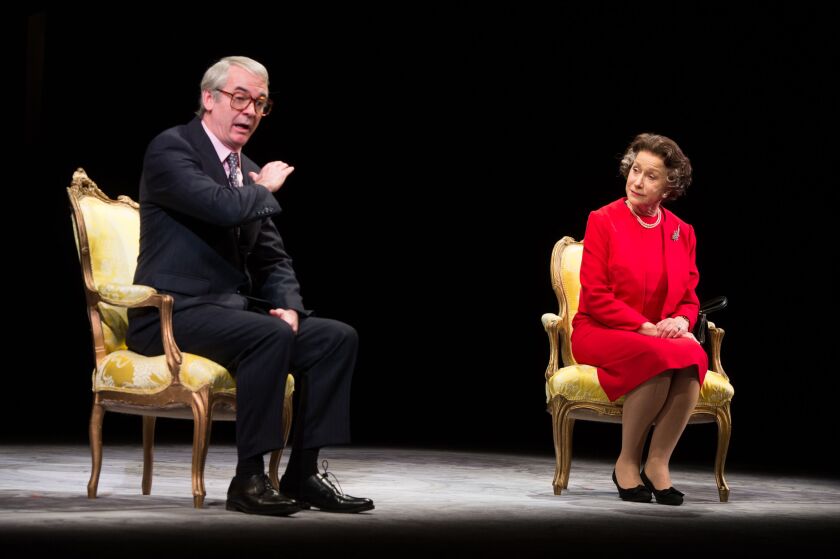 Helen Mirren and Paul Ritter perform on stage during a rehearsal for “The Audience” at the Gielgud Theatre in 2013, in London, England.