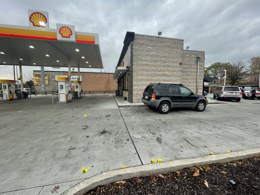 Police placed evidence markers near several shell casings at a Shell Gas station Thursday afternoon in Chatham.