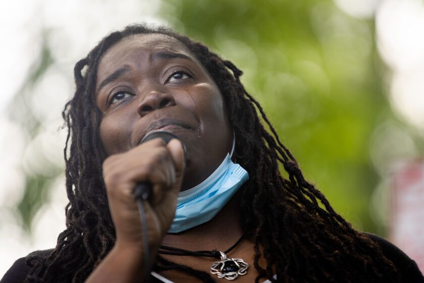LaShandra Smith-Rayfield tears up while speaking at a racial justice rally Friday afternoon July 31, 2020 after she confronted a group of white people displaying a Confederate flag at the beach Wednesday. | Pat Nabong/Sun-Times