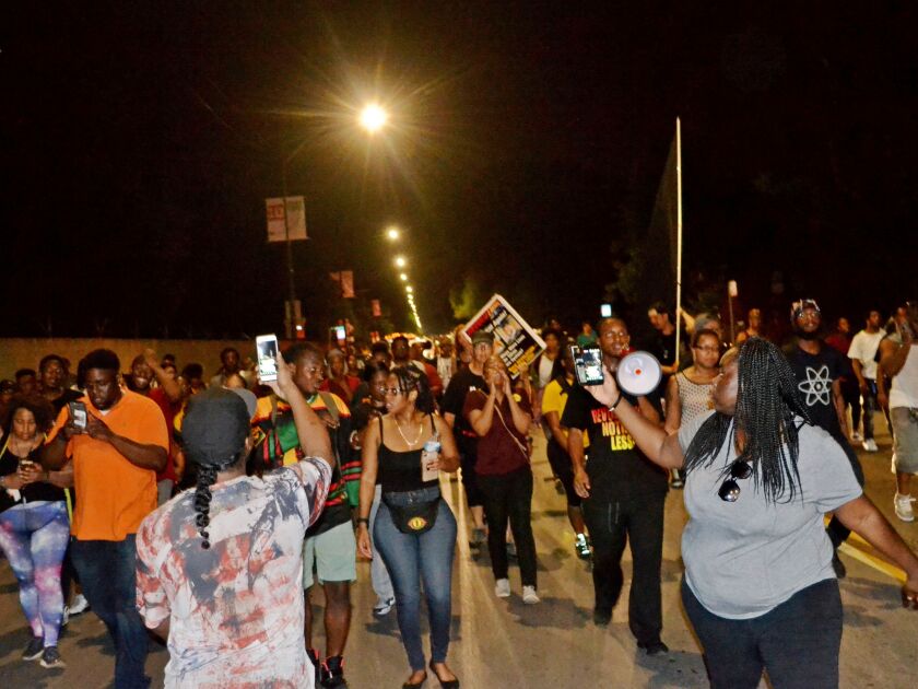 Protesters march to the 3rd District Police Station about 11:30 p.m. Saturday, July 14, 2018, in the 7000 block of South Cottage Grove Ave in Chicago. | Justin Jackson/ Sun-Times