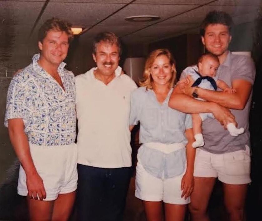 Henry “Hank” Obrzut with (from left) his son Tony, daughter Pati Coy and son Mike, holding grandson Mike.