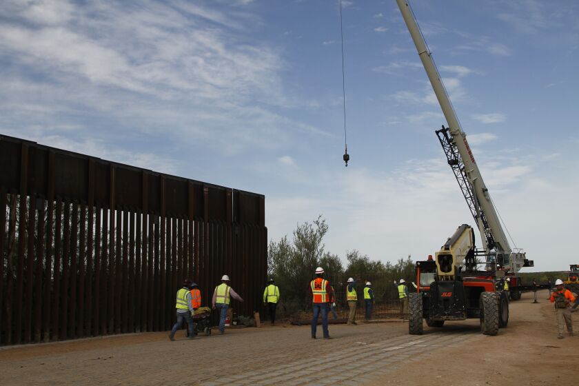 Workers break ground on new border wall construction about 20 miles west of Santa Teresa, New Mexico, last week.