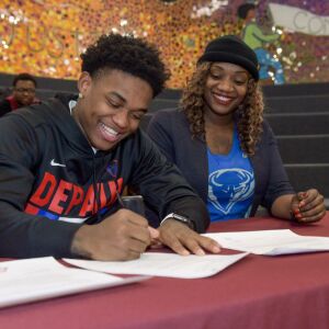 With his mom Appolonia Stover at his side, Uplift basketball player Markese Jacobs signs his letter of intent to play for DePaul. Mark Black/For the Sun-Times.
