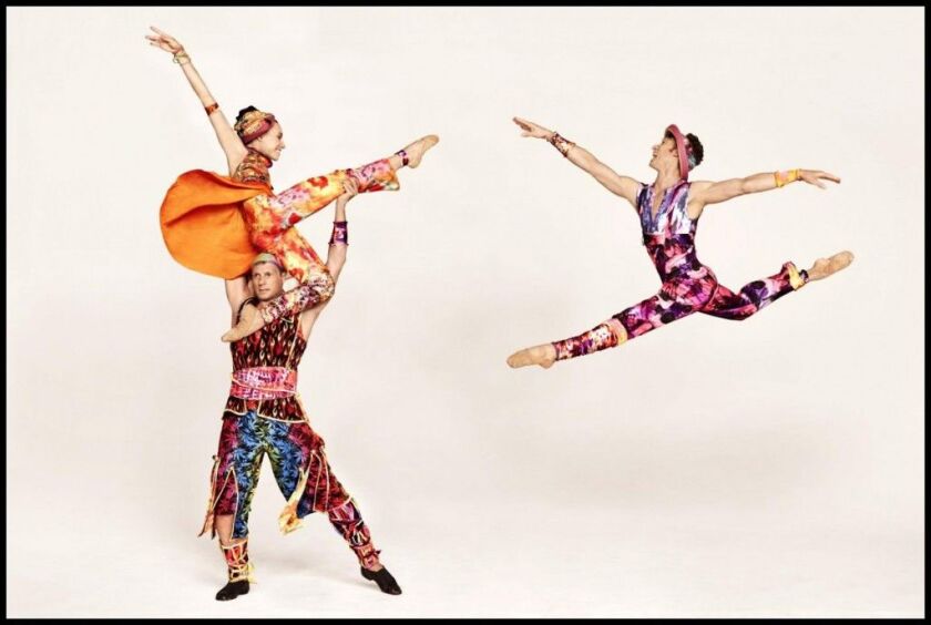 Amy Ruggiero (aloft) and John Selya (left), with Ron Todorowski (right) in Twyla Tharp’s “Yowzie.” (Photo: Ruven Afanador)