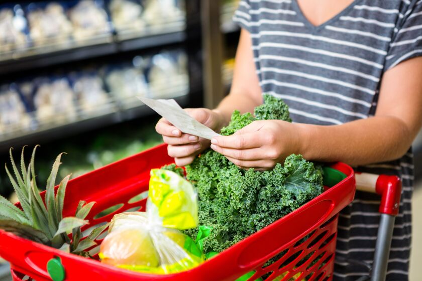 Plan your meals ahead of time and always bring a shopping list along (there are dozens of phone apps that can help you create a list digitally) so you buy exactly what you need and you avoid return trips to the grocery store. | STOCK.ADOBE.COM