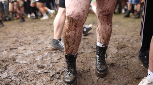 A Die Spitz fan is covered in mud on Day 3 of Lollapalooza in Grant Park.