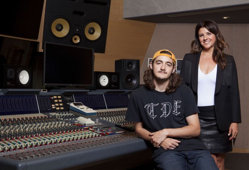 In this May 4, 2018 photo, Deacon Frey, son of the late Eagles co-founder Glenn Frey and his mother Cindy Frey pose for a portrait at Dog House Recording Studio in Los Angeles. Deacon Frey is keeping his dad’s legacy alive by touring and performing with t
