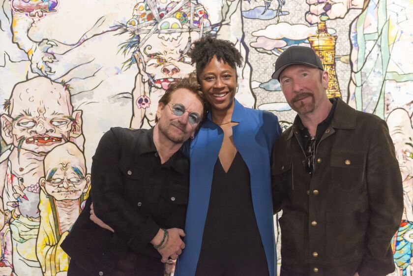 U2’s Bono and The Edge were given a tour of the Takashi Murakami exhibit at the MCA by curator Naomi Beckwith earlier this month when the band played Soldier Field. | PHOTO COURTESY THE MCA