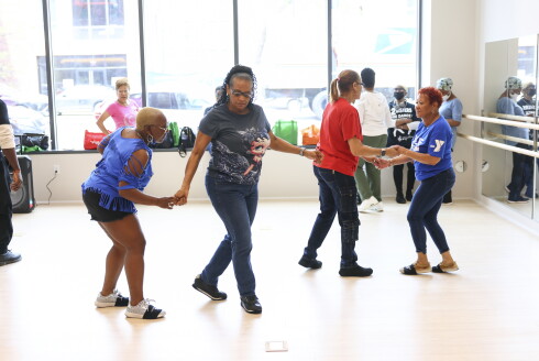Members of the 2 Sisters Line Dance & Steppin during a workshop at the opening of the Sankofa Village Wellness Center on Thursday.