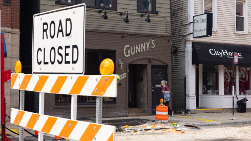 Construction cones line the closed street in front of Gunny's Bar in Lincoln Park.