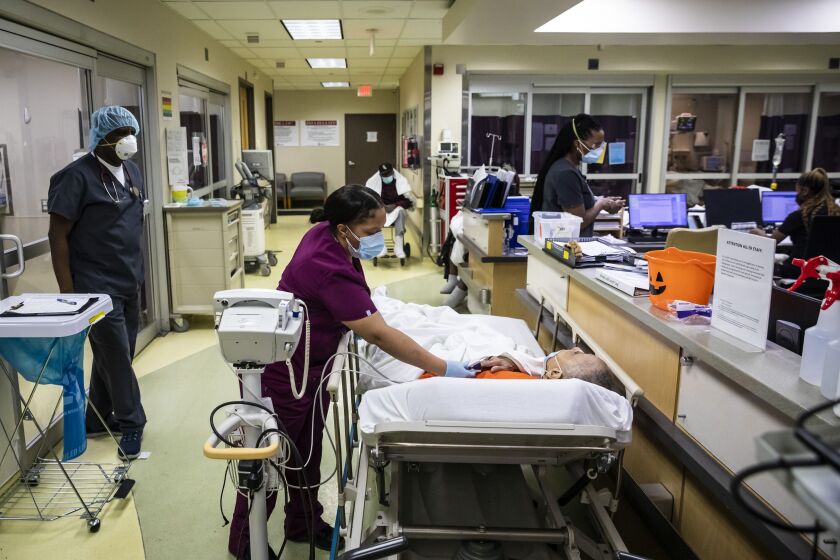 Medical assistant Cassandra Munoz checks a patient’s vitals in the hallway, as no rooms were open that January day in the Emergency Department at Roseland Community Hospital on the Far South Side.