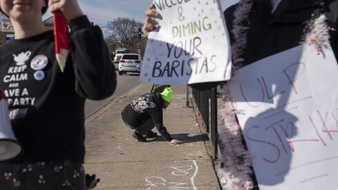 Starbucks employees and supporters picket outside an Evanston location, as part of a nationwide strike by Starbucks Workers United at 65 stores.