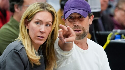 Justin Ishbia, right, brother of Phoenix Suns owner Mat Ishbia, and his wife Kristen Ishbia, left, sit courtside during the first half of an NBA basketball game against the Chicago Bulls, Saturday, Feb. 22, 2025, in Chicago.