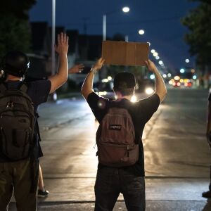 Protesters block traffic as they peacefully march around Kenosha on the fourth day of civil unrest after police shot Jacob Blake, Wednesday night, Aug. 26, 2020.