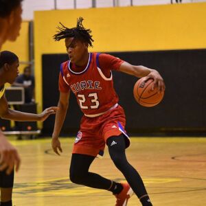 Curie’s Ramean Hinton (23) crosses the ball over. Worsom Robinson/For the Sun-Times.