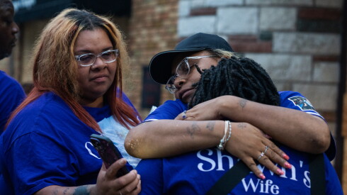 Franquella Campbell (left) and Marshawna Campbell comfort their mother’s wife Alesia Williams-Shannon during a vigil outside South Chicago Chapel in South Deering.