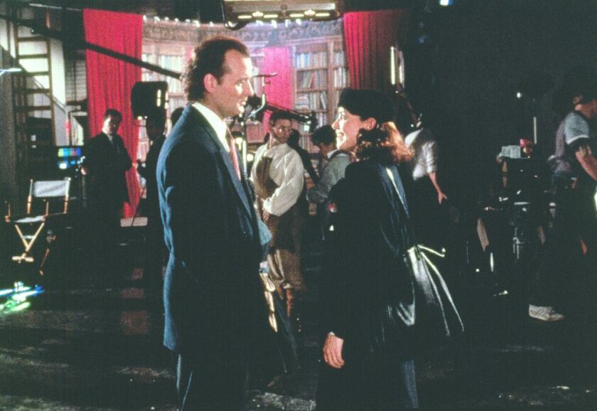 Bill Murray and Karen Allen in a scene from “Scrooged.” | Paramount