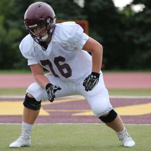 Loyola’s Christo Kelly listens as an audible is called during a practice.