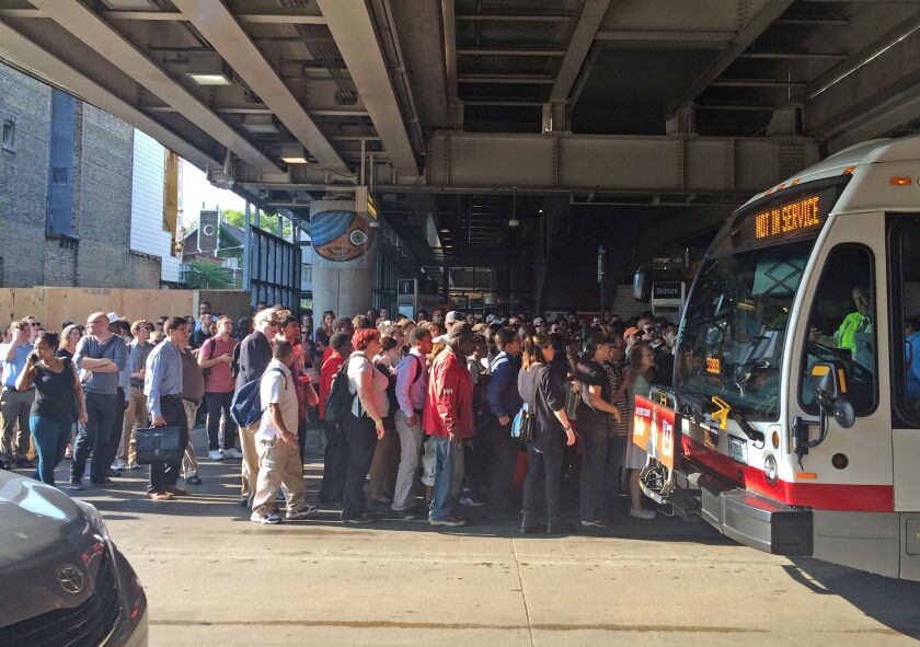 The area under the Belmont CTA station became crowded and the situation grew tense as commuters tried to get downtown Tuesday. | Emily Moon/For the Sun-Times