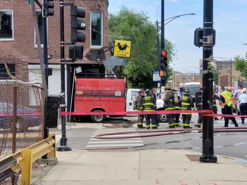 The truck was sent flying onto the sidewalk after the crash.