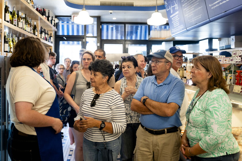 People who are part of the tour group “Yes, Chef!” prepare to exit Publican Quality Meats in River North, Saturday, June 13, 2026. | Pat Nabong/Sun-Times