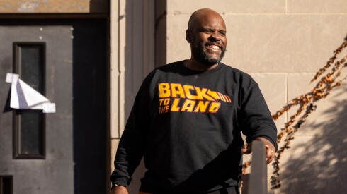 Lead Steward L. Anton Seals, Jr. stands at an emergency food giveaway organized by his organization, Grow Greater Englewood, and the Englewood Food Sovereignty Network in partnership with the Greater Chicago Food Depository on the South Side, Saturday, Nov. 15, 2025. | Candace Dane Chambers/Sun-Times.