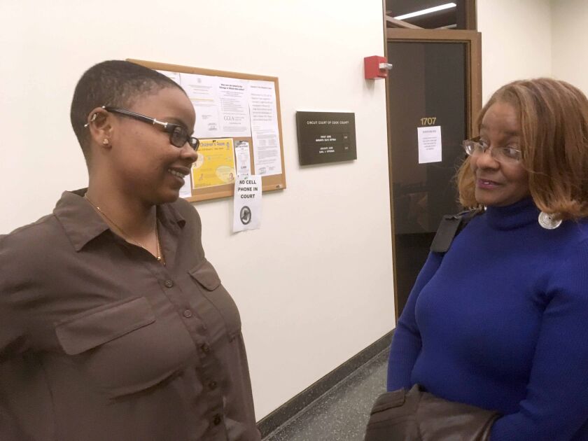 Symone Smith and her mother Antoinette Smith at the Daley Center shortly after a judge signed paperwork in March letter her get her car back. | Stefano Esposito / Sun-Times